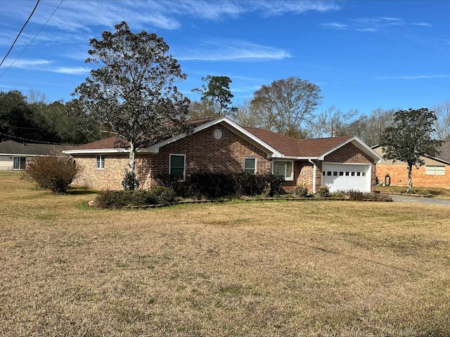 single story home featuring a garage and a front yard