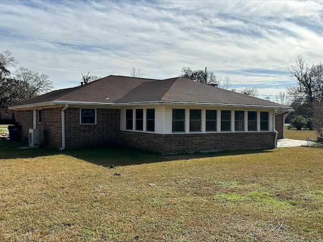 view of home's exterior featuring a yard