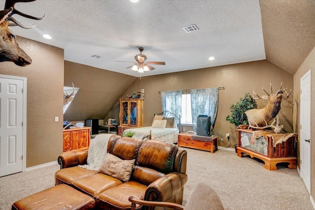 bedroom with ceiling fan, carpet floors, a textured ceiling, and vaulted ceiling