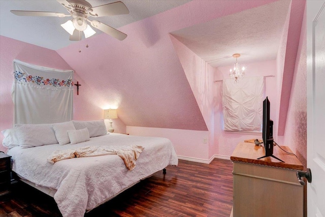 bedroom featuring ceiling fan with notable chandelier, dark wood-type flooring, and vaulted ceiling