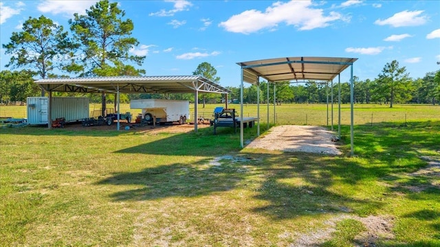 view of yard with a storage unit and a carport