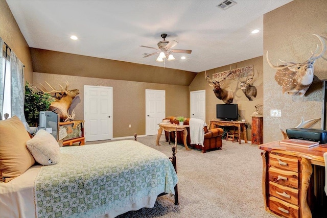 bedroom with ceiling fan, carpet floors, and lofted ceiling