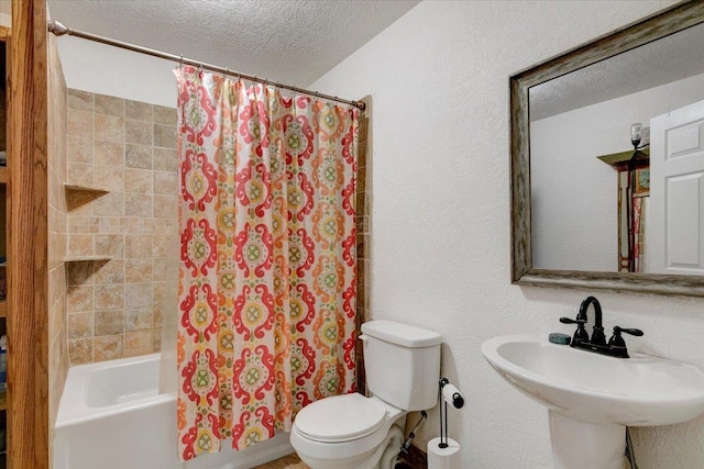 full bathroom featuring toilet, a textured ceiling, shower / tub combo with curtain, and sink