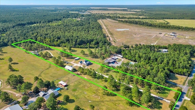 birds eye view of property with a rural view