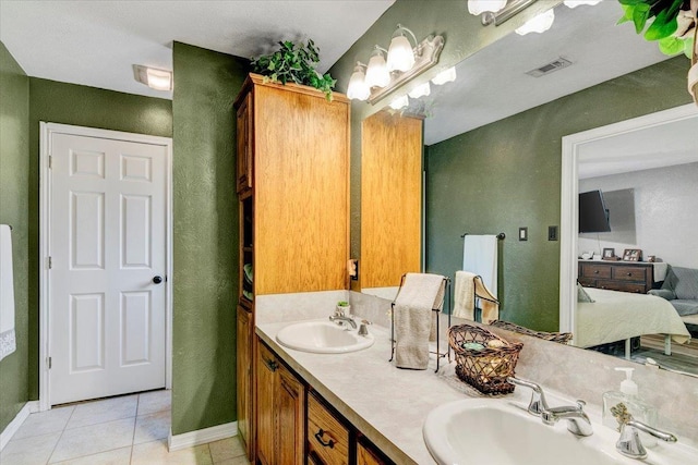 bathroom featuring tile patterned floors and vanity