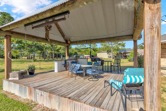 deck with a gazebo and a yard