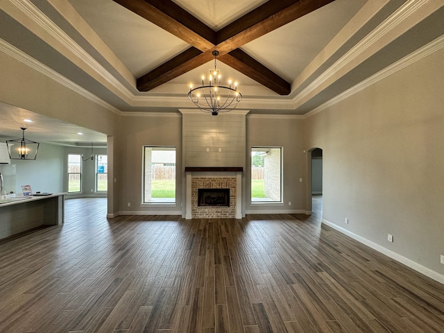 unfurnished living room with beam ceiling, coffered ceiling, a large fireplace, and dark hardwood / wood-style floors