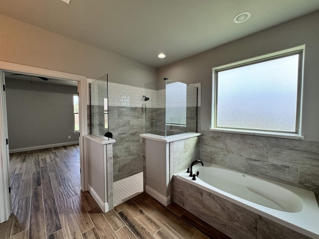 bathroom with shower with separate bathtub