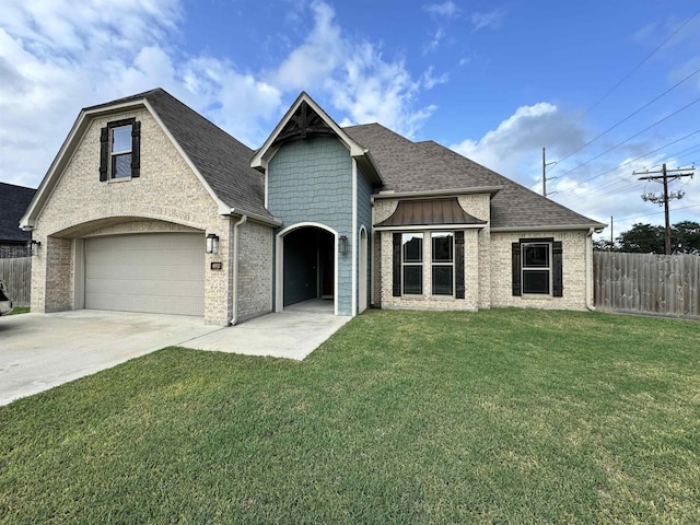 view of front of home with a garage and a front yard