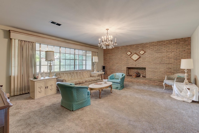 carpeted living room with a fireplace, brick wall, and an inviting chandelier