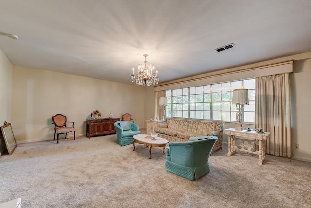 living room with light carpet and a chandelier