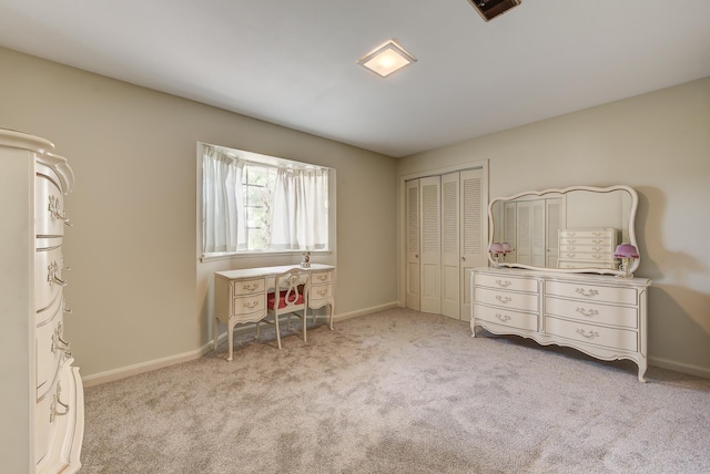 bedroom with light carpet and a closet