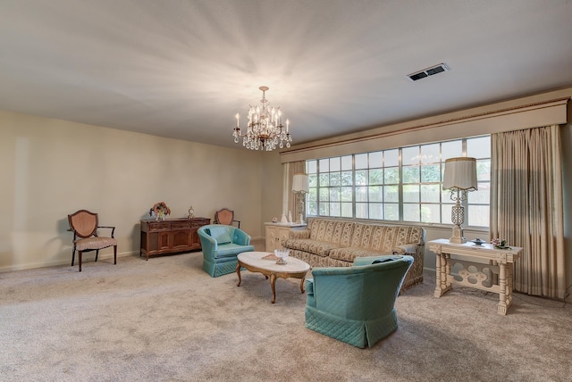 living room with carpet flooring and a notable chandelier