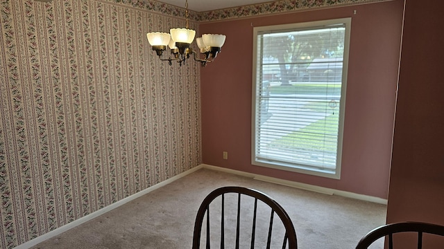 unfurnished dining area with carpet floors and a notable chandelier