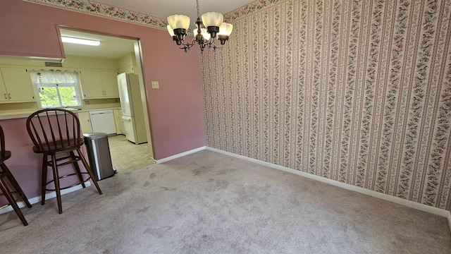 unfurnished dining area with light colored carpet and an inviting chandelier