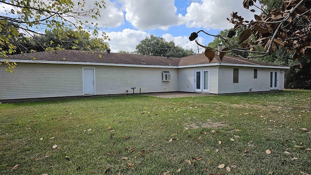 back of house with a lawn, french doors, and a patio