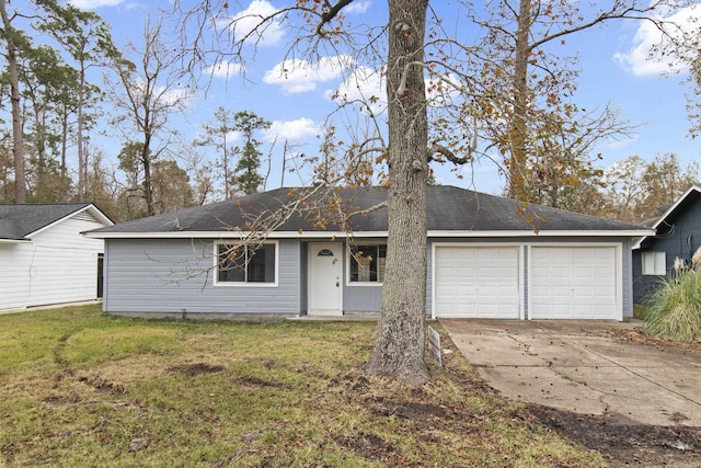 ranch-style home with a front lawn and a garage