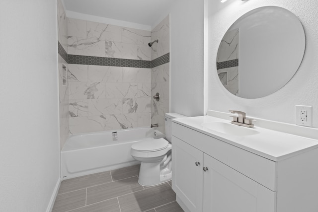 full bathroom featuring toilet, tiled shower / bath combo, and vanity