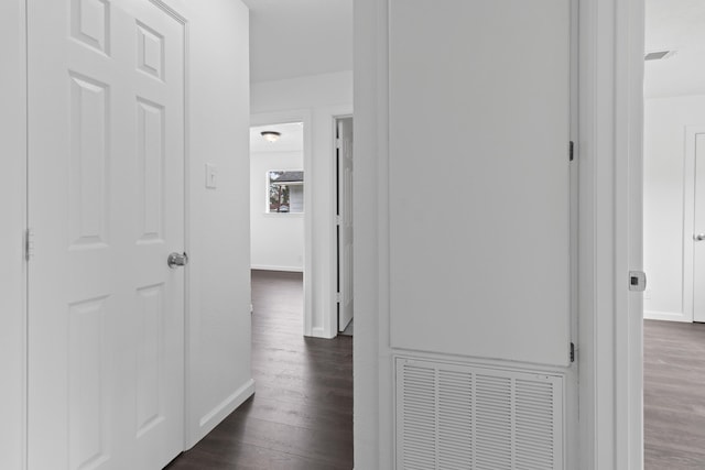 hall with dark wood-type flooring