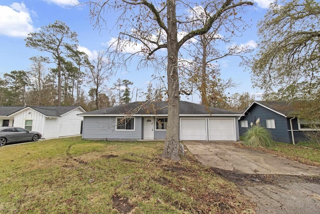 ranch-style house featuring a front lawn and a garage