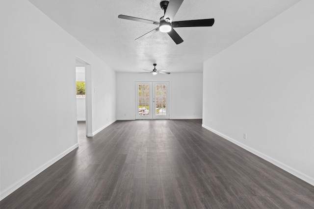 unfurnished room with ceiling fan, french doors, and dark hardwood / wood-style floors