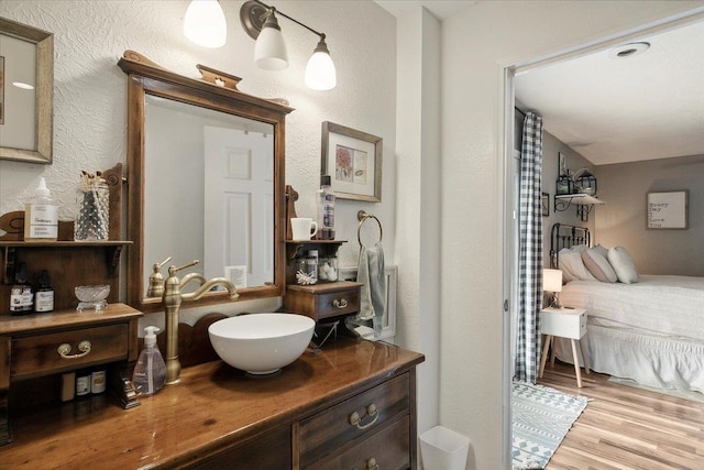 bathroom featuring hardwood / wood-style floors and vanity