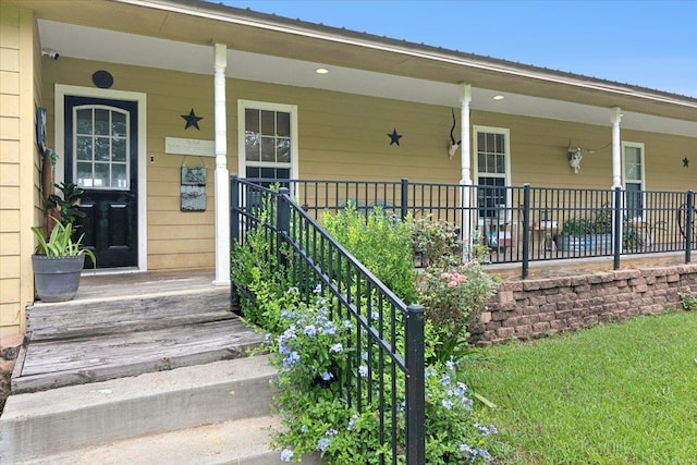 property entrance featuring covered porch