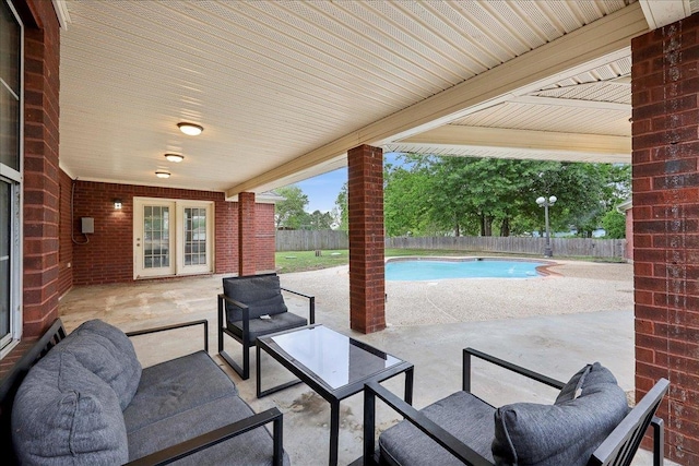 11503 Davidson Rd, Beaumont, TX 77705 - fenced backyard with a patio area and outdoor lounge area