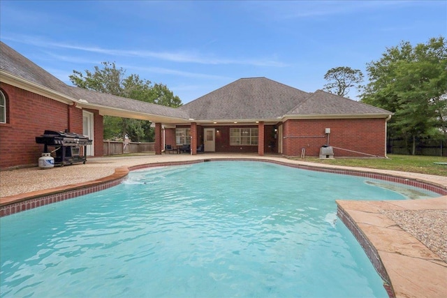 11503 Davidson Rd, Beaumont, TX 77705 - view of pool featuring a grill and a patio area