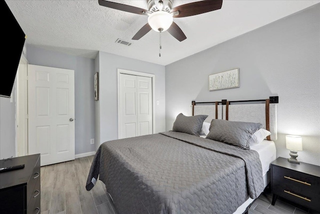 11503 Davidson Rd, Beaumont, TX 77705 - bedroom with a closet, light wood-type flooring, and a ceiling fan