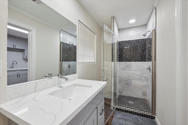 11503 Davidson Rd, Beaumont, TX 77705 - bathroom with vanity, a stall shower, recessed lighting, tasteful backsplash, and ornamental molding