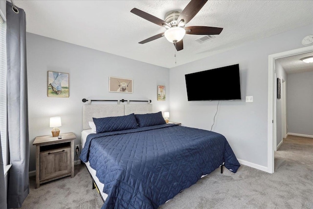 11503 Davidson Rd, Beaumont, TX 77705 - bedroom with light carpet, ceiling fan, and a textured ceiling
