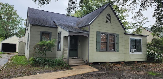 bungalow-style house with an outbuilding and a garage