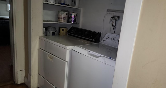 washroom with washing machine and clothes dryer