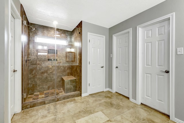 bathroom with a shower with shower door