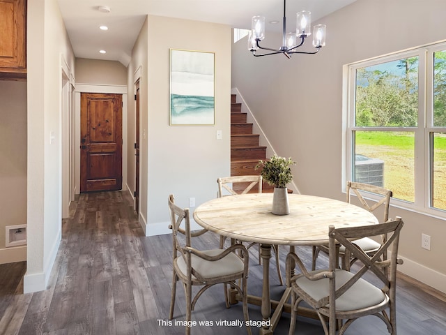 dining space with stairs, baseboards, dark wood-style floors, and a wealth of natural light