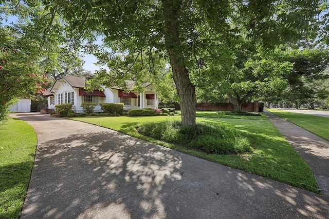2621 Evergreen Dr, Port Arthur, TX 77642 - view of front of home featuring a front lawn, driveway, and a garage