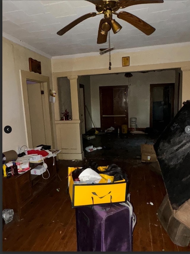 interior space featuring dark hardwood / wood-style floors, ceiling fan, and crown molding