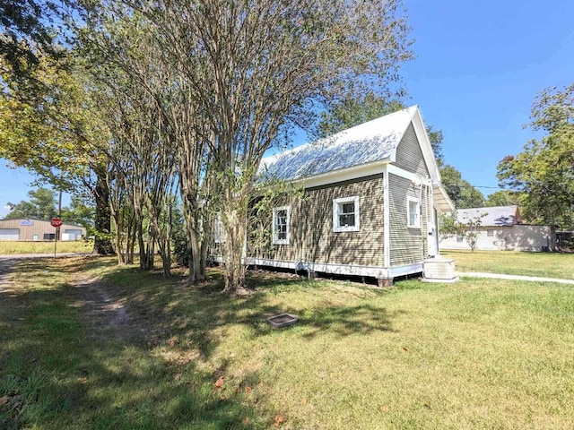 view of home's exterior featuring a yard