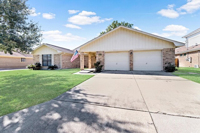 single story home with a garage and a front yard