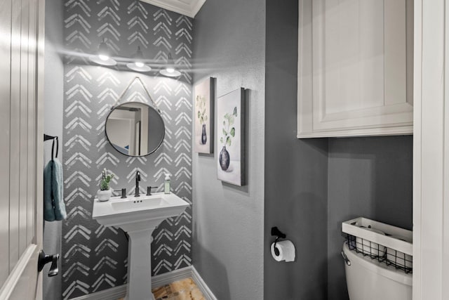 220 Idylwild Dr, Sour Lake, TX 77659 - half bathroom featuring crown molding, baseboards, and toilet