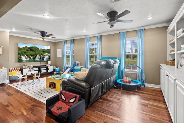220 Idylwild Dr, Sour Lake, TX 77659 - living room featuring crown molding, a textured ceiling, ceiling fan, and wood finished floors
