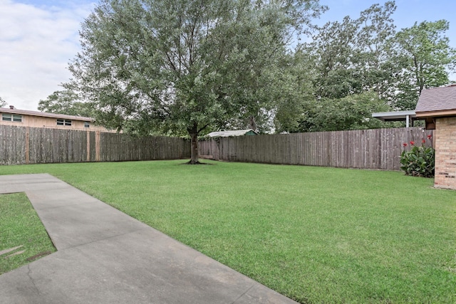 6355 Arrowhead Dr, Beaumont, TX 77707 - view of yard with a fenced backyard