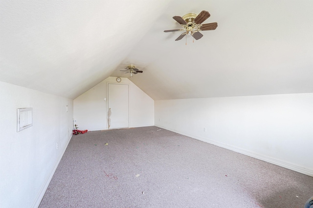 additional living space with ceiling fan, lofted ceiling, and light carpet