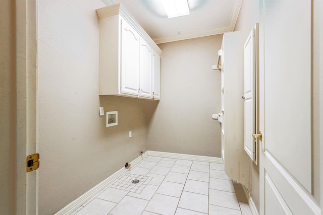 laundry area with cabinets, washer hookup, crown molding, and light tile patterned flooring