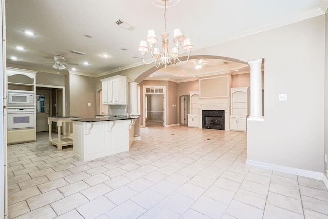 kitchen featuring ornamental molding, white appliances, pendant lighting, white cabinets, and light tile patterned flooring