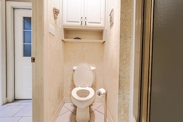 bathroom with tile patterned flooring and toilet