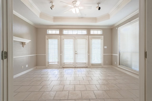 doorway to outside with a raised ceiling, ceiling fan, crown molding, and light tile patterned flooring