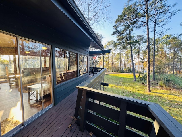 wooden deck with a lawn