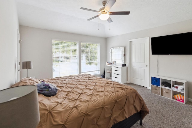 bedroom with ceiling fan and carpet